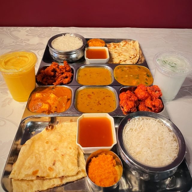 Lunch combo tray with curries, rice and naan