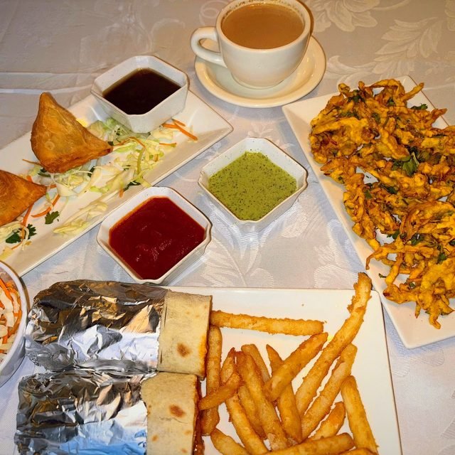 Samosa, pakora and a kathi roll with chai