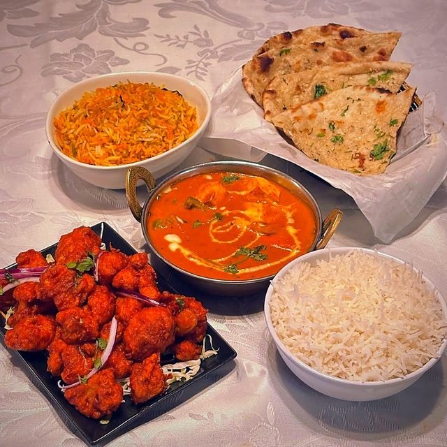Paneer butter masala with naan and rice